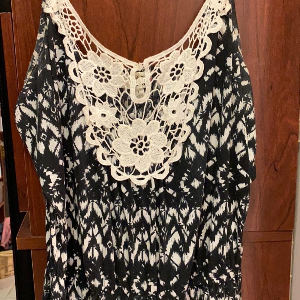 Long romper with lace middle front.